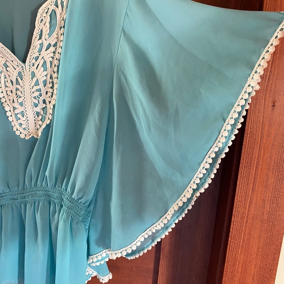 Blouse with detailed trim in light blue teal, size medium. - Picture 3 of 4